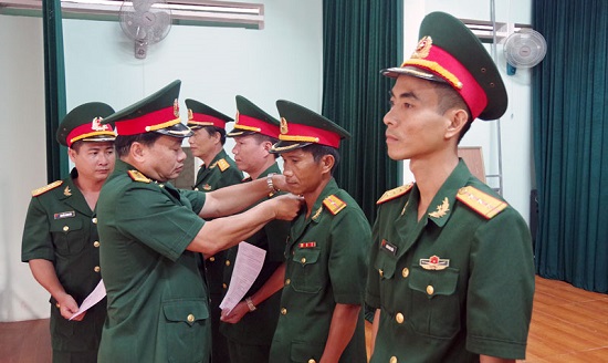 Powers to make decisions on professional servicemen, National defense workers and officials in Vietnam